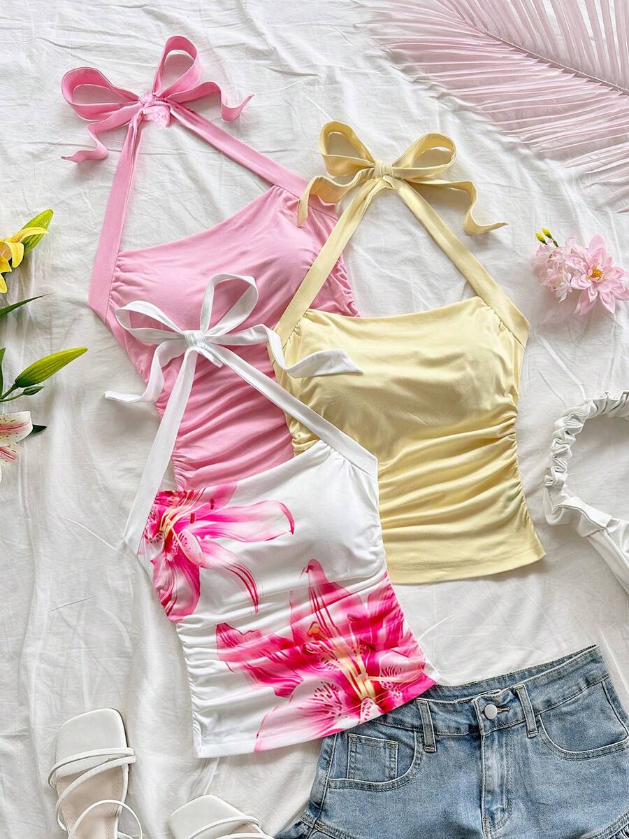 SHEIN Bộ đồ dệt kim 3 món cho bé gái tuổi teen, họa tiết hoa dâm bụt nhiều màu, cổ yếm, eo thắt nơ, áo hai dây ôm sát, thời trang cho mùa xuân/hè, thích hợp cho tiệc tùng, ngày lễ tình nhân, tiệc trà chiều, lễ Phục sinh, lễ hội hóa trang, du thuyền biển. - Nhiều màu - Xem 1