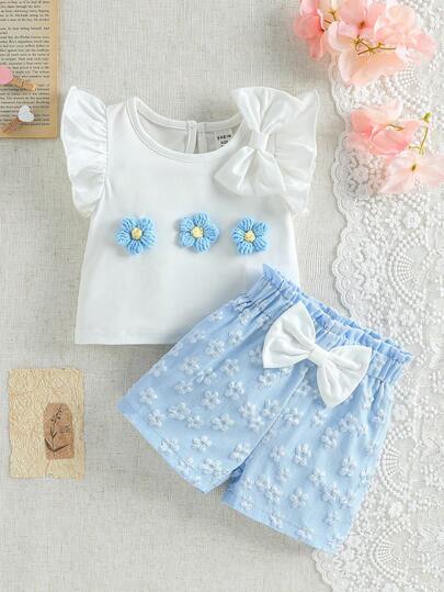 SHEIN Bộ áo thun và quần short bé gái họa tiết hoa và nơ, thích hợp mặc hàng ngày, đi chơi, du lịch và mọi mùa.