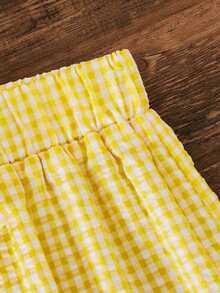 SHEIN Sparklyn 这款少女可爱黄色格纹两件套夏季套装，包括一件荷叶边露背上衣，饰有蕾丝蝴蝶结肩带，以及一条松紧腰短裤。采用轻盈面料制成，宽松的A字廓形，非常适合日常休闲穿着和玩耍。 - 黃色 - 查看 8