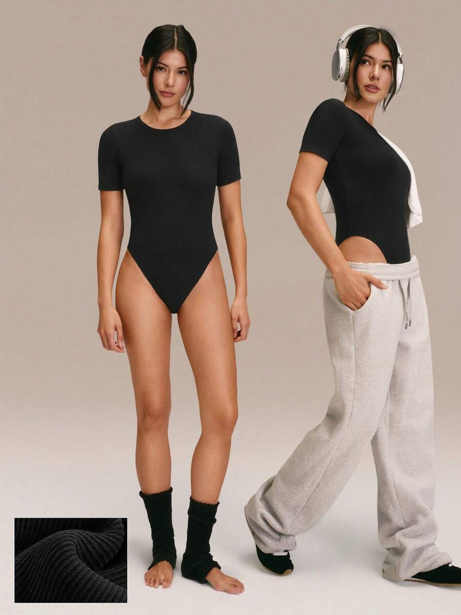 GLOWMODE Bodyduit de algodón pima acanalado, listo para fluir, ultra suave, transpirable, ligero, elástico, con cierre a presión, sin acolchado, de manga corta y cuello redondo, para yoga, pilates, estudio y uso casual diario - Negro - Ver 1