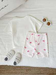 SHEIN Set de 2 piezas de pijama para niña bebé con shorts estampados a cuadros y camiseta de manga corta holgada de verano - Multicolor - Ver 2