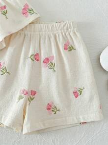 Bộ đồ bé gái dễ thương đi nghỉ mát, họa tiết hoa, trang trí nơ, gồm áo hai dây và quần cạp chun. - trắng - Xem 6