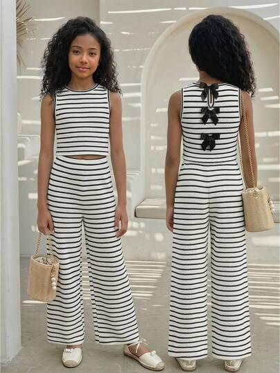 SHEIN Bộ đồ 2 món cho bé gái tuổi teen mùa xuân/hè, kiểu dáng tối giản, màu đen trắng kẻ sọc, gồm áo không tay và quần legging, điểm nhấn là nơ trang trí.