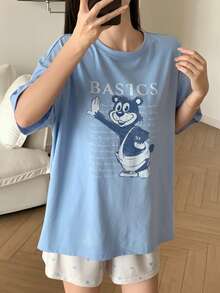Bộ đồ ngủ nữ in hình hoạt hình, gồm áo thun cổ tròn và quần short. - Màu xanh lam - Xem 4