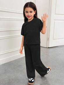 SHEIN Conjunto de camiseta de manga corta con cuello redondo y hombros caídos & pantalones largos, estilo suelto, casual, minimalista y cómodo para niñas jóvenes - Negro - Ver 6