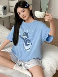Bộ đồ ngủ nữ in hình hoạt hình, gồm áo thun cổ tròn và quần short. - Màu xanh lam - Xem 5