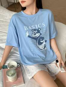 Bộ đồ ngủ nữ in hình hoạt hình, gồm áo thun cổ tròn và quần short. - Màu xanh lam - Xem 1