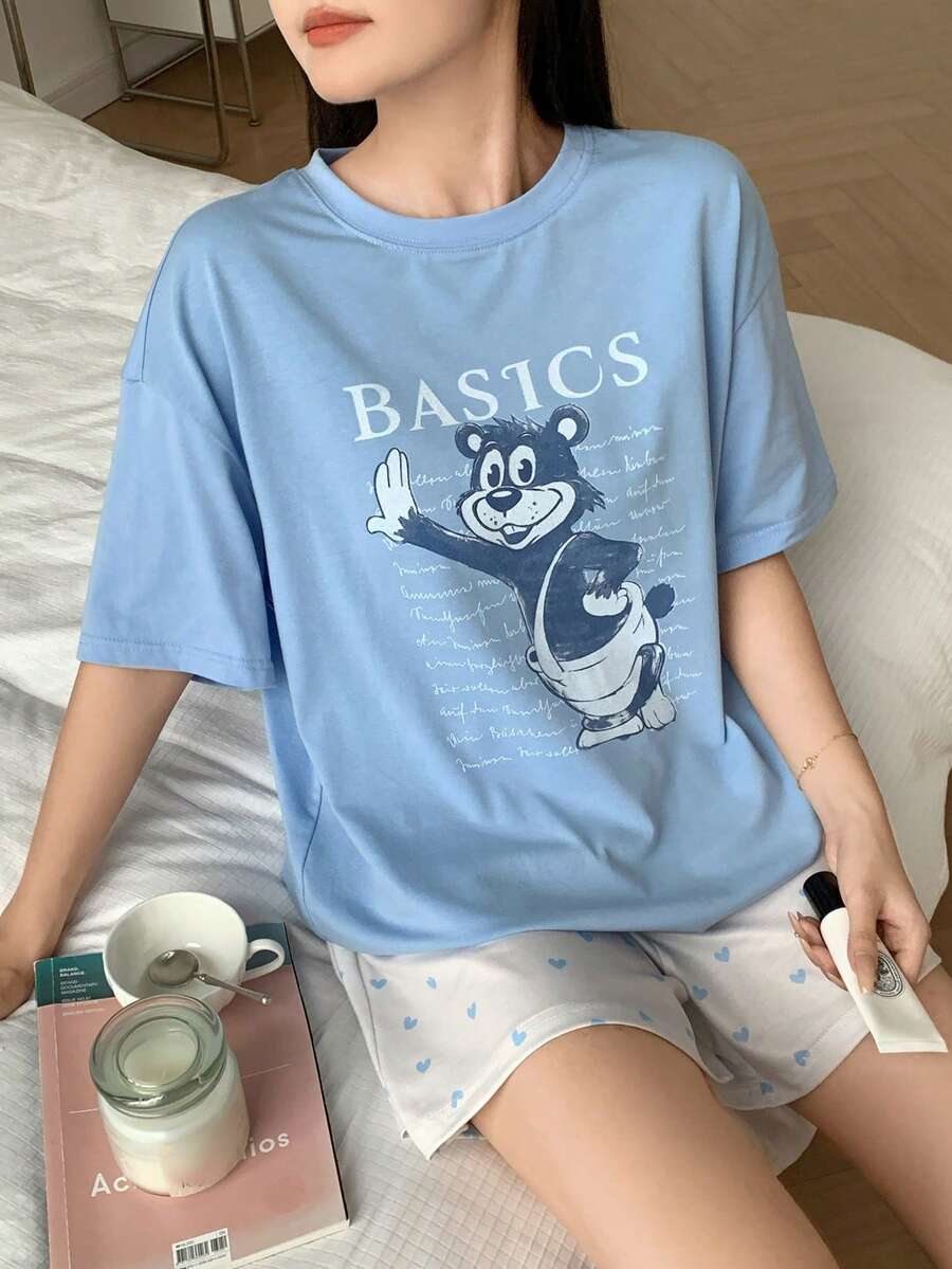 Bộ đồ ngủ nữ in hình hoạt hình, gồm áo thun cổ tròn và quần short. - Màu xanh lam - Xem 1
