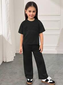 SHEIN Conjunto de camiseta de manga corta con cuello redondo y hombros caídos & pantalones largos, estilo suelto, casual, minimalista y cómodo para niñas jóvenes - Negro - Ver 3