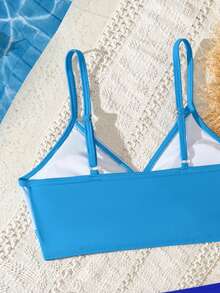 SHEIN Bộ bikini cho bé gái tuổi teen, kiểu dáng tối giản tươi mát với áo phối màu xanh tương phản và thiết kế xoắn phía trước, cổ chữ V, dây mảnh, quần cạp cao màu xanh navy trơn, 2 mảnh, chất liệu vải dệt kim, thời trang, thoải mái, thanh lịch, thích hợp cho bơi lội, kỳ nghỉ hè, bãi biển, hồ bơi, tiệc tùng, kỳ nghỉ thư giãn, đồ bơi hai mảnh kiểu yếm. - Nhiều màu - Xem 4