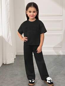 SHEIN Conjunto de camiseta de manga corta con cuello redondo y hombros caídos & pantalones largos, estilo suelto, casual, minimalista y cómodo para niñas jóvenes - Negro - Ver 4