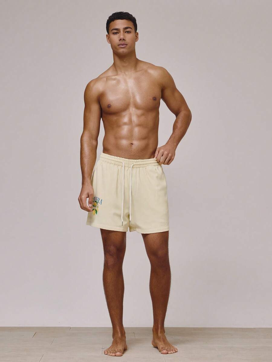 Musero Shorts de baño de ajuste regular con cintura elástica y cordón, con detalles gráficos laterales, esenciales para vacaciones de primavera y verano, traje de baño para la playa y la piscina - Mostaza Amarilla - Ver 1