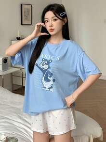 Bộ đồ ngủ nữ in hình hoạt hình, gồm áo thun cổ tròn và quần short. - Màu xanh lam - Xem 9