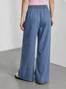 SHEIN Calça jeans feminina para adolescentes, lançamento 2026, estilo casual e moderno para o verão. Jeans azul médio, cintura elástica com pregas, modelagem reta e solta. Confeccionada em tecido jeans leve e macio, confortável e agradável ao toque. Uma peça essencial para meninas, com estilo minimalista e casual, perfeita para o verão, uso diário, ensaios fotográficos, passeios, festas, festivais de música, férias e muito mais. - Lavagem Média - Ver 2