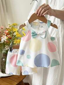 SHEIN Bộ áo ba lỗ cổ yếm in chấm bi mùa hè cho bé gái và quần short cùng màu, trang phục thường ngày dễ thương, phù hợp cho các hoạt động ngoài trời và mặc hàng ngày. - Nhiều màu - Xem 8