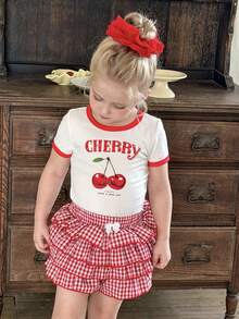 SHEIN Bộ 2 món gồm áo thun dệt kim cổ tròn màu trơn và quần short kẻ caro cho bé gái, kiểu dáng thường ngày. - Nhiều màu - Xem 4