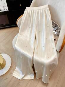 GlowEve CURVE Quần ống rộng dáng suông thanh lịch cỡ lớn, chất liệu ánh ngọc trai, thiết kế xếp ly giúp thon gọn vóc dáng, phù hợp cho đi làm hàng ngày, hẹn hò, dự tiệc và các dịp trang trọng. - Màu be - Xem 1