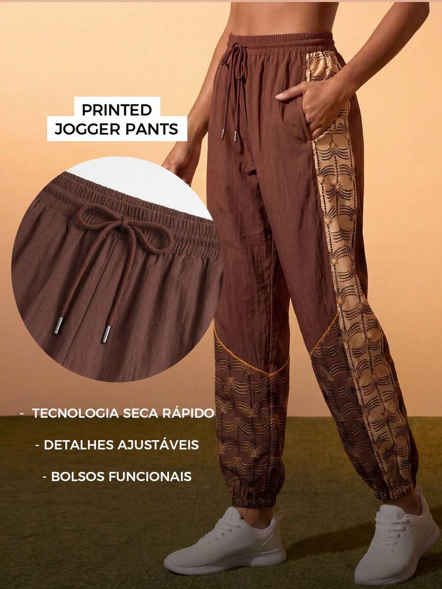 Quần jogger thể thao nữ có dây rút ở eo, in họa tiết.