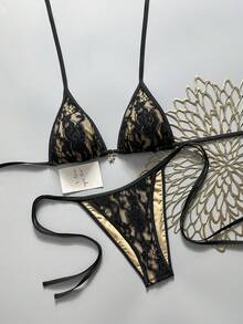 SHEIN Swim Vcay Bộ bikini hai mảnh dáng suông, dây mảnh, buộc hông, cạp cao, màu da, lót ren hoa nhiều màu sắc, kiểu dáng nghỉ mát, thích hợp cho mùa xuân/hè 2026. - màu đen - Xem 1