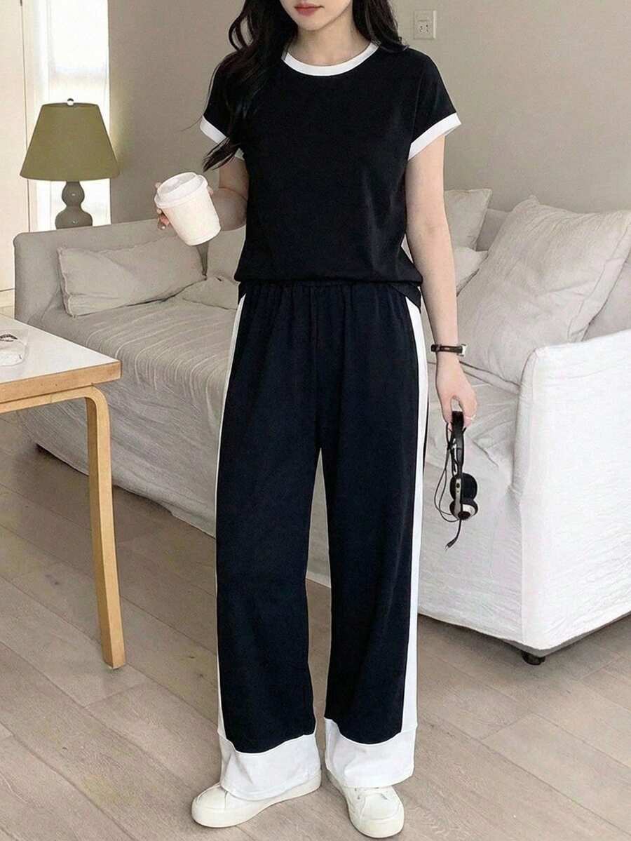 SHEIN 少女夏季时尚针织黑白撞色宽松T恤+撞色宽松阔腿裤套装,休闲运动街头风,适合上学、户外活动等场合。夏季女装休闲套装,黑白休闲套装,夏季女装搭配,女士休闲套装,夏季女装,上下装套装,女士阔腿裤套装 - 黑與白 - 查看 1