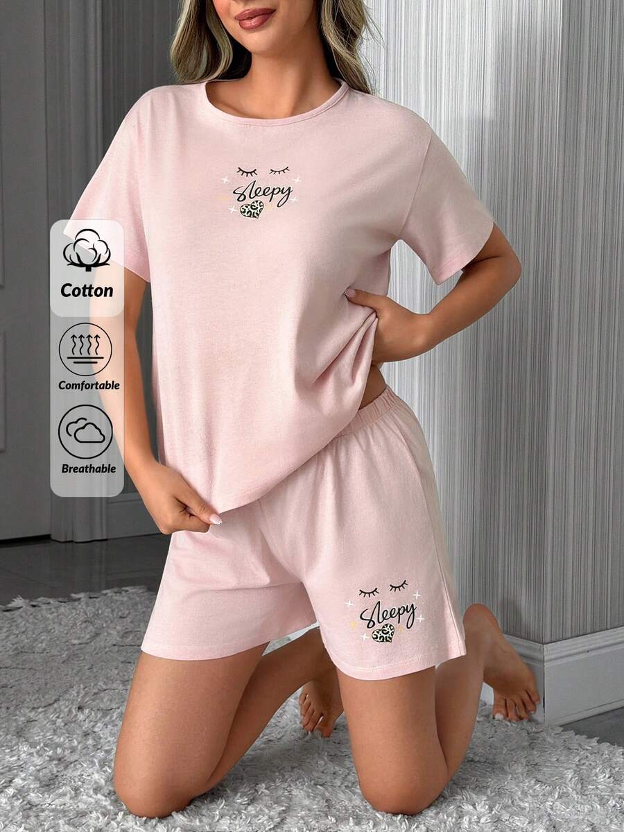 SHEIN Bộ đồ 2 món gồm áo thun ngắn tay cổ tròn màu hồng trơn và quần short cạp cao họa tiết chữ của Cotton Line dành cho nữ, kiểu dáng thoải mái và năng động. - Bụi hồng - Xem 1