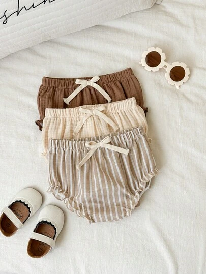 SHEIN Bộ 3 quần short trẻ em unisex cho bé trai/bé gái, màu trơn và kẻ sọc, cạp chun, thích hợp cho mùa xuân/hè.