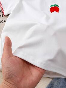 Souflis Souflis Bộ đồ đi học cho bé gái: Áo thun cổ tròn thêu họa tiết dễ thương và quần váy denim thêu hình quả anh đào, thích hợp cho mùa hè. - trắng - Xem 6