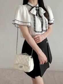 FRIFUL Bộ đồ 2 mảnh dành cho nữ, gồm váy cổ cao xếp lớp phối màu tương phản, viền bèo nhún và cổ nơ, dáng chữ A, thích hợp cho mùa hè. - Đen và trắng - Xem 6