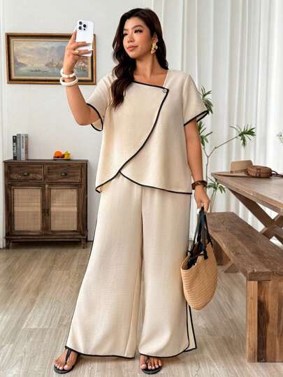 Weeklong Bộ đồ thể thao 2 mảnh dành cho nữ cỡ lớn, phối màu tương phản, chất liệu giả lanh thoải mái, gồm áo tay ngắn có khuy gỗ trang trí và quần có túi xẻ bên hông, thích hợp cho kỳ nghỉ.
