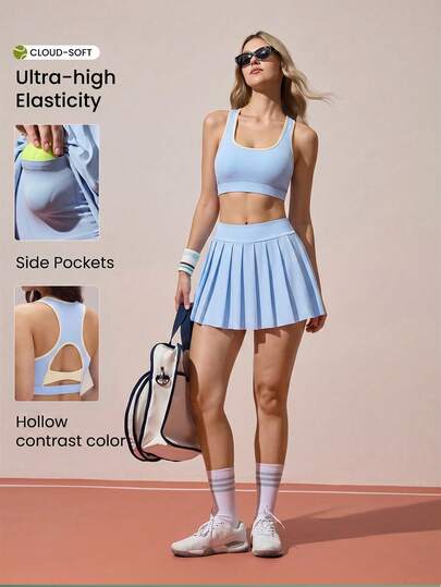 CourtClass Bộ đồ chơi golf dành cho nữ - Áo bra thể thao viền ren và quần short xếp ly.