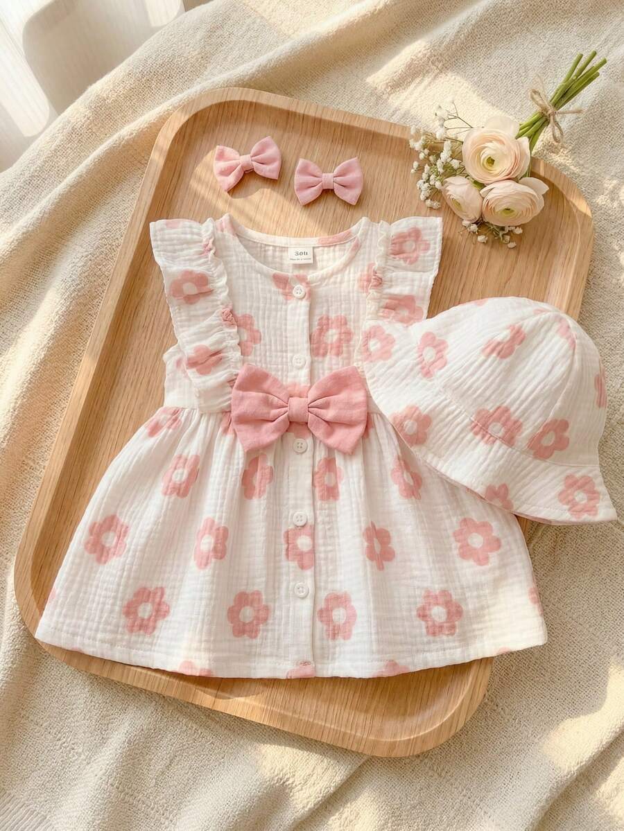 SHEIN Playful Pals 1 pieza Vestido de niña recién nacida de tela suave blanca con estampado floral rosa, cuello redondo, sin mangas, volantes en el bajo, con cierre a presión. Incluye sombrero/sombrero de sol redondo. Lindo, casual, fresco, dulce, elegante, adecuado para salidas diarias de verano, compras, escuela, viajes, fotografía, parque, fiestas y diversas ocasiones interiores/exteriores - Rosa Pálido - Ver 1