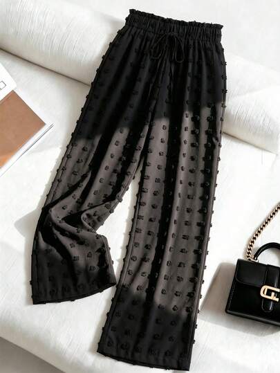 SHEIN Franclia Quần ống đứng màu trơn, ống loe, gấu quần loe, phối họa tiết quả cầu lông xù, màu đen, phong cách thường ngày năng động, thích hợp cho kỳ nghỉ biển, thời trang đường phố boho vintage thanh lịch dành cho nữ mùa xuân/hè.