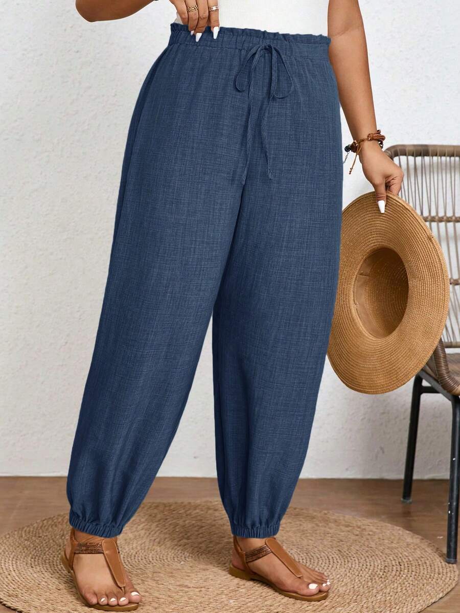 SHEIN Frenchy Pantalones largos de cintura alta con nudo delantero y estampado tropical para mujer, ideal para vacaciones de verano - Azul Marino - Ver 1