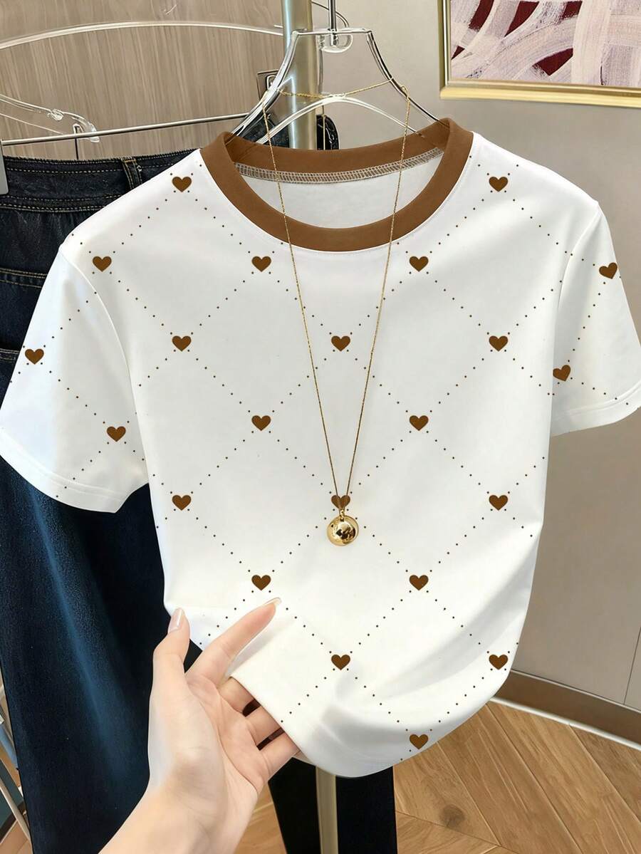 Resyla Áo thun nữ cổ tròn tay ngắn họa tiết hình trái tim và chấm bi - trắng - Xem 1