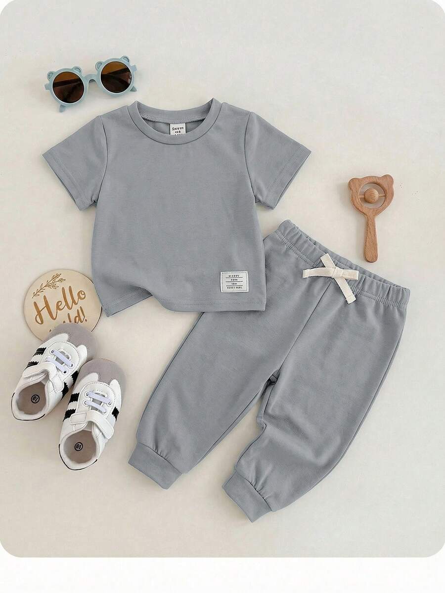 Conjunto de 2 piezas de niño/niña bebé con top de cuello redondo de manga corta y pantalones de cintura elástica, de tela suave y elástica, decorativo de punto, adecuado para salidas, vacaciones, escuela y hogar - Gris - Ver 1