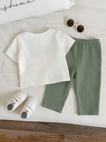 SHEIN 2pcs Baby Boys/Girls Cute Casual Waffle Fabric Short Sleeve Pants Pajama Set, Suitable For Home, Daily Wear And Outings, Spring/Summer - Multicolor - View 2