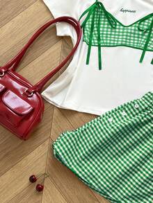 Bộ 2 món gồm áo thun cổ tròn cỡ lớn in hình bướm và quần short kẻ caro cạp chun. - Nhiều màu - Xem 4