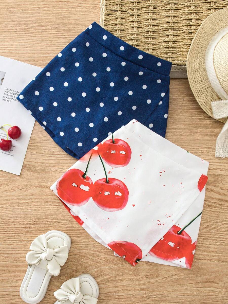 SHEIN Genkimix Kids Bộ 2 quần short denim dáng bất đối xứng họa tiết chấm bi và quả anh đào, màu xanh dương và hồng, thích hợp cho bé gái đi chơi mùa hè. - Nhiều màu - Xem 1