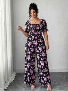Elenzga Bộ áo liền quần nữ cổ vuông họa tiết hoa nhí, tay cánh hoa, lưng hở, thắt nơ phía trước. - màu đen - Xem 3