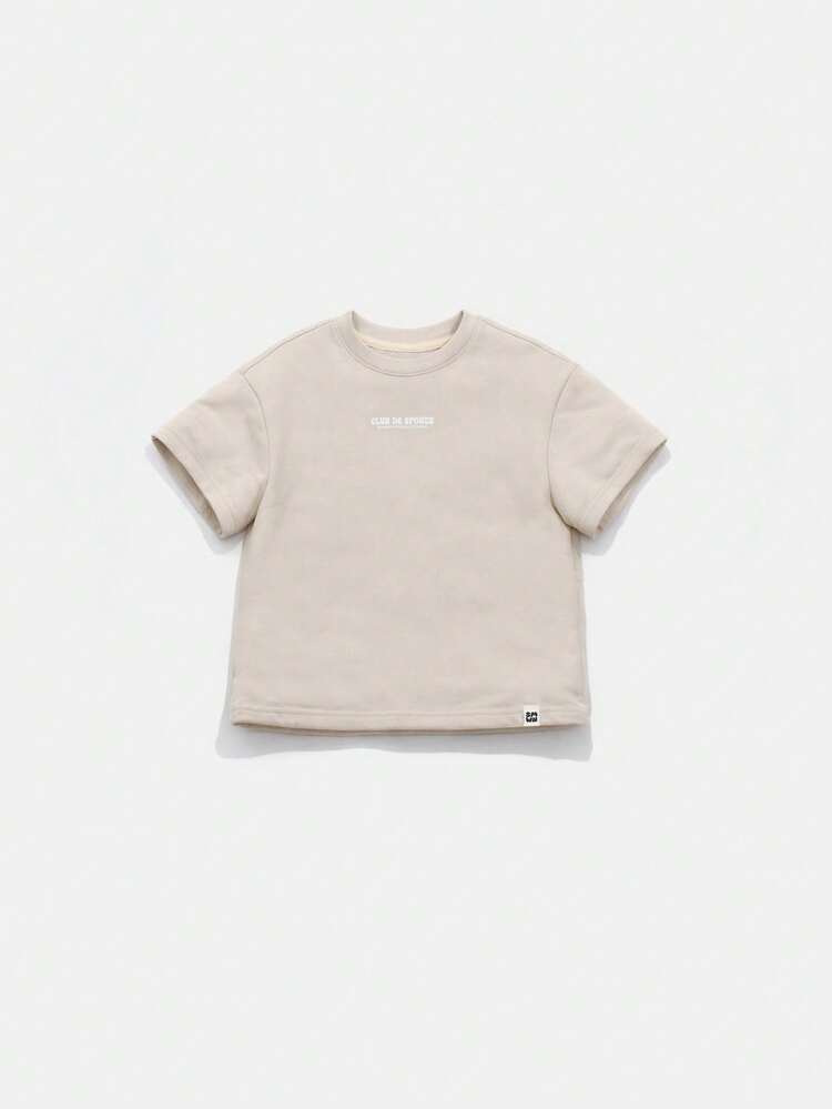 T-shirt col rond en coton à manches courtes, avec graphique de club de tennis surdimensionné, thème sportif décontracté, beige, pour garçons