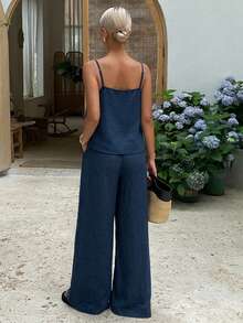 Bộ 2 món thời trang nữ gồm áo hai dây crop top xếp ly và quần ống rộng cạp cao buộc dây, thích hợp mặc mùa hè. - Xanh đậm - Xem 2