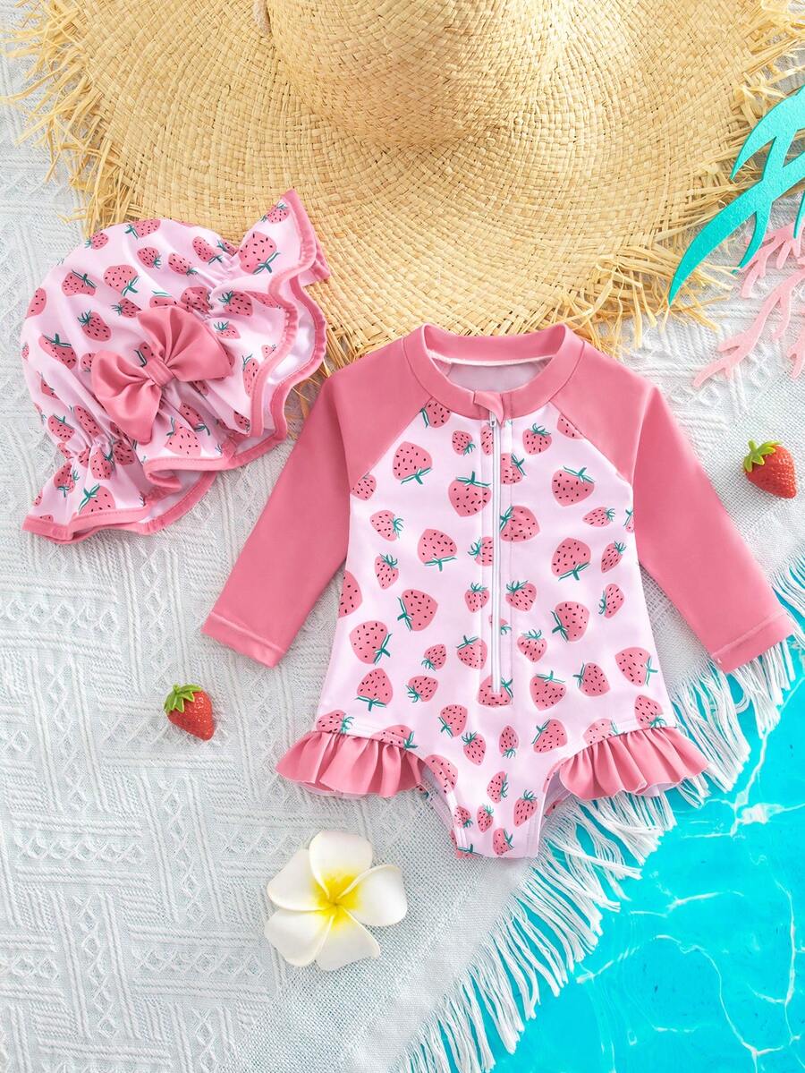 SHEIN Traje de baño de manga larga con cuello redondo, cremallera, estampado de fresa, volantes y empalmes para niña, ideal para vacaciones y playa - Rosa - Ver 1