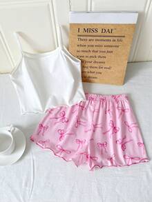 SHEIN Bộ đồ ngủ trẻ em Dozemod dành cho bé gái tuổi teen, gồm 2 món, hộp quà ngẫu nhiên: áo tay ngắn cài cúc cổ bẻ kiểu tối giản với nơ và sọc, cùng bộ đồ ngủ dệt kim rộng rãi, thoải mái. - Màu Hồng baby - Xem 2
