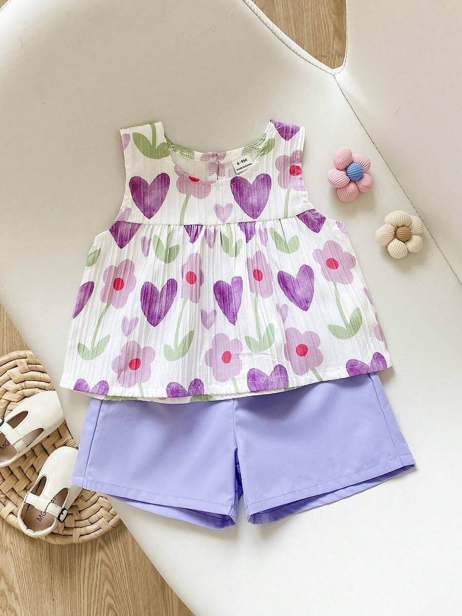 SHEIN Playful Pals 女童两件套夏季圆领无袖上衣搭配红色短裤。清新红白撞色，梭织面料，宽松版型。风格甜美、优雅、田园风，通体印有樱桃图案，活泼可爱。适合日常外出、上下学、参加派对、生日聚会、度假旅行等场合。