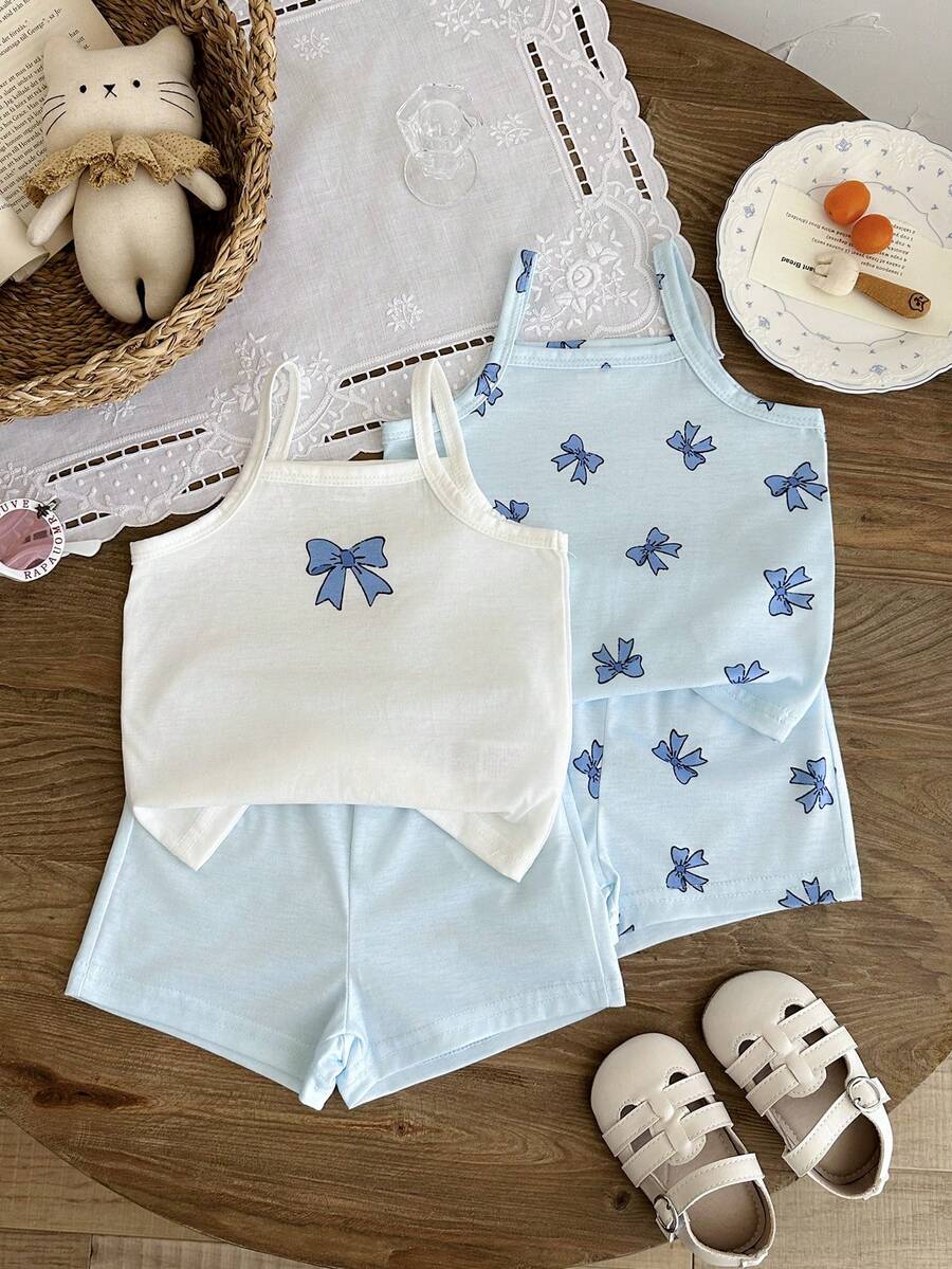 SHEIN Bộ đồ hè 4 món dễ thương và thoải mái cho bé gái: Áo tank top trắng hồng in hình nơ hồng và quần short – Bộ 4 món - Màu xanh nhạt - Xem 1