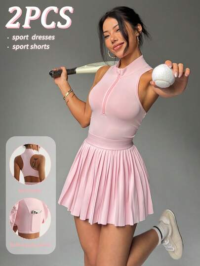 CourtClass Chân váy thể thao nữ màu hồng không tay cổ polo kiểu tennis, cạp chun phối sọc tương phản, gấu chun, lưng khoét rỗng, quần short bên trong có túi, thích hợp cho mặc thường ngày, chạy bộ, yoga, tập gym, tennis, golf.