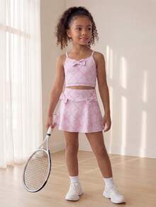SHEIN Conjunto activo de niñas jóvenes con lazo rosa - Conjunto de top y falda con diseño de lazo y estampado de raqueta, tela elástica y suave a la piel, perfecto para deportes al aire libre, juegos en el patio y uso casual - Rosa - Ver 6