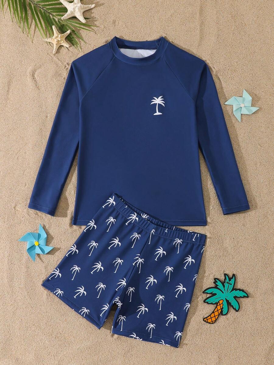 SHEIN Bộ đồ bơi 2 mảnh cho bé trai tuổi teen, phong cách kỳ nghỉ nhiệt đới, màu xanh hải quân với họa tiết cây cọ, chất liệu vải dệt kim, áo thun dài tay + quần bơi, trang phục đi nghỉ mát thời trang thường ngày phù hợp cho bơi lội, kỳ nghỉ hè, bãi biển, hồ bơi. - Màu xanh hải quân - Xem 1
