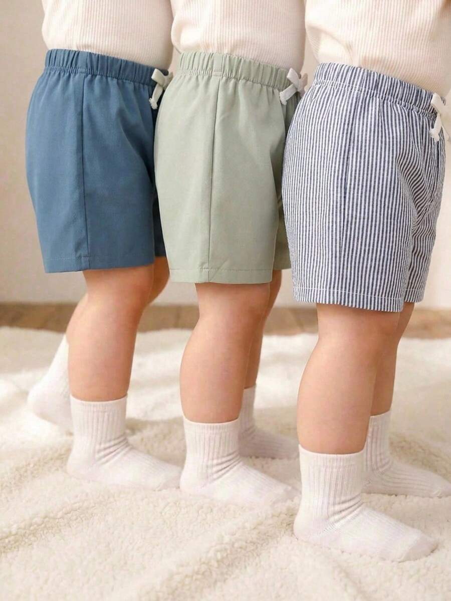 SHEIN Bộ 3 quần short cho bé sơ sinh/trẻ nhỏ, kiểu dáng unisex, màu mơ kẻ caro, màu trơn, sọc, cạp chun, chất liệu mềm mại và thoải mái, thích hợp cho mùa hè.