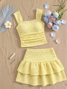 Bộ đồ 2 mảnh thời trang thanh lịch mùa xuân hè dành cho bé gái, gồm áo ba lỗ và chân váy midi hai lớp, chất liệu vải dệt họa tiết, kiểu dáng thường ngày, phù hợp cho các buổi đi chơi, chụp ảnh đường phố và mặc hàng ngày. - Màu vàng - Xem 4